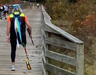 Walkers on a boardwalk section of the trail